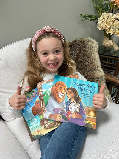 Little girl smiling with her BRAVE Books