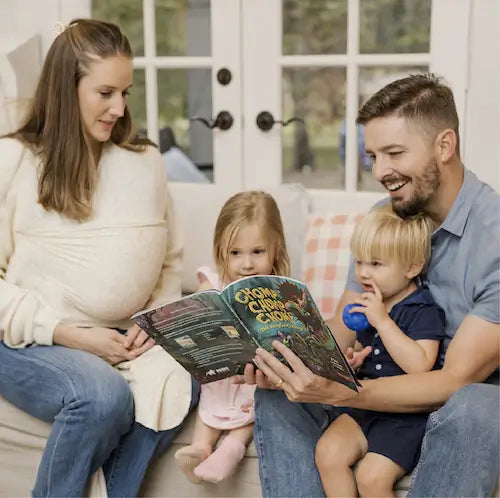 Trent Talbot and his family reading Chomp Chomp Chomp, a BRAVE Books book
