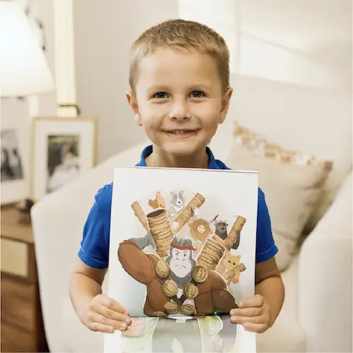 Little boy holding a BRAVE Books book