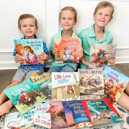 3 boys sitting with 15 different BRAVE Books books smiling