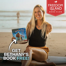 Bethany Hamilton holding her children's book Surfing Past Fear promoting Freedom Island Book Club