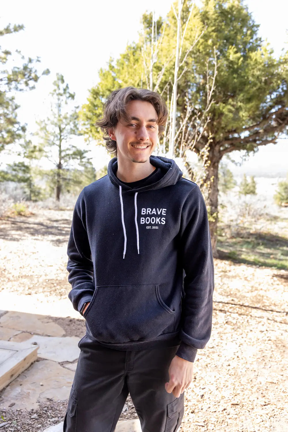 Man wearing BRAVE Books pro-god, pro-America hoodie