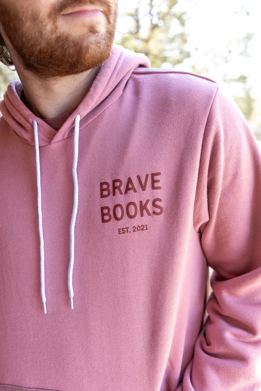 Man wearing BRAVE Books pro-god, pro-America hoodie