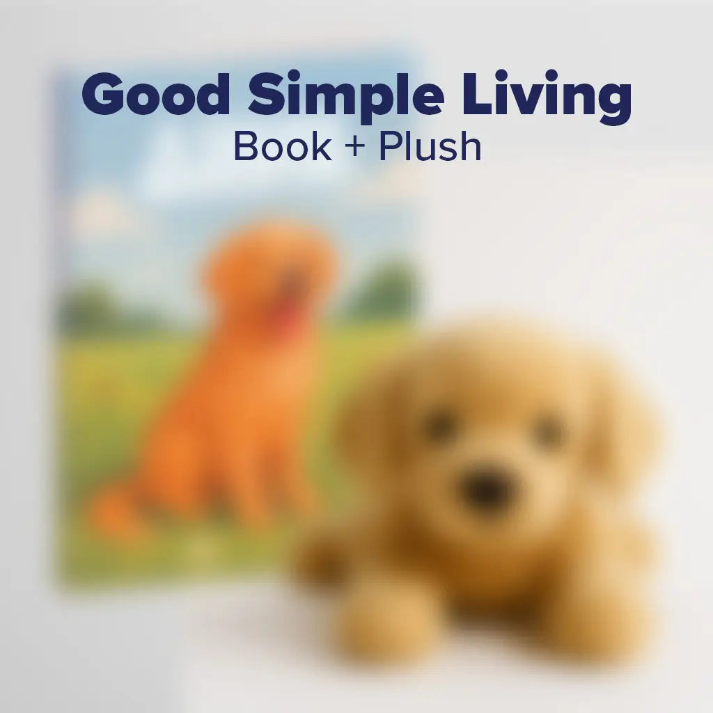 Blurred image of a book titled 'Good Simple Living' with a plush toy in the foreground.