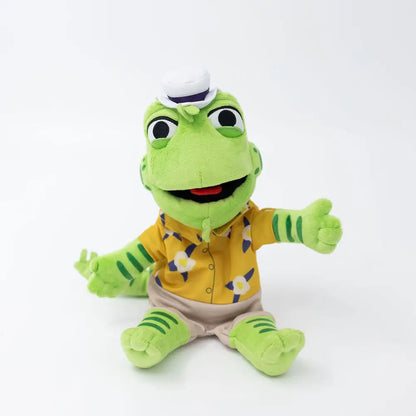 Plush toy frog wearing a yellow shirt with a white background