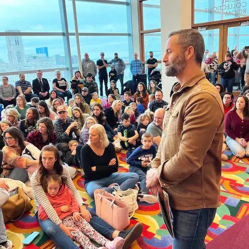 Kirk Cameron at a BRAVE Books story hour speaking to a crowd of people