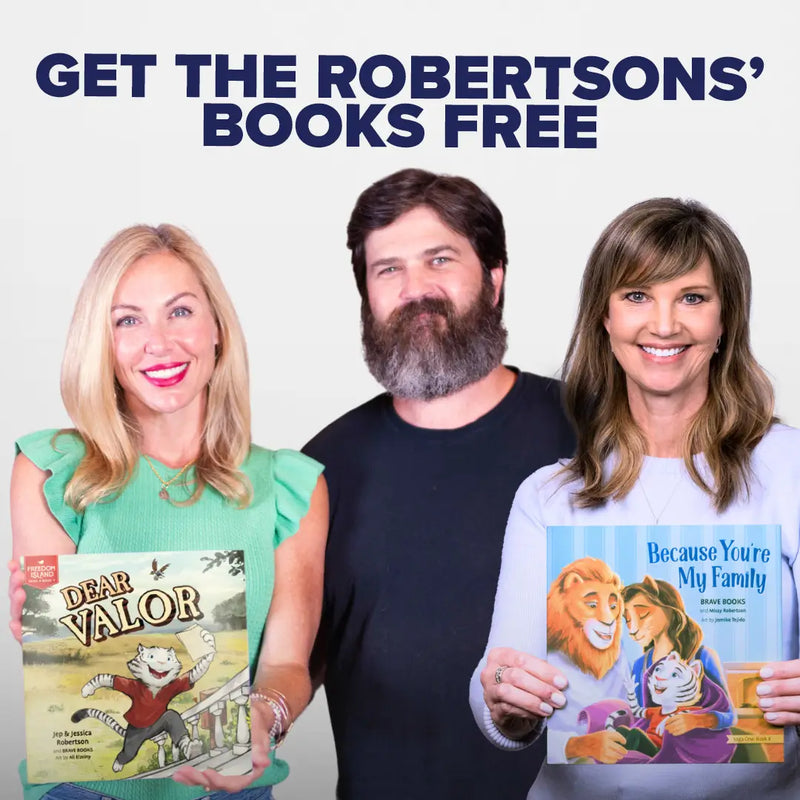 The Robertson family holding their BRAVE Books, Dear Valor and Because You're My Family