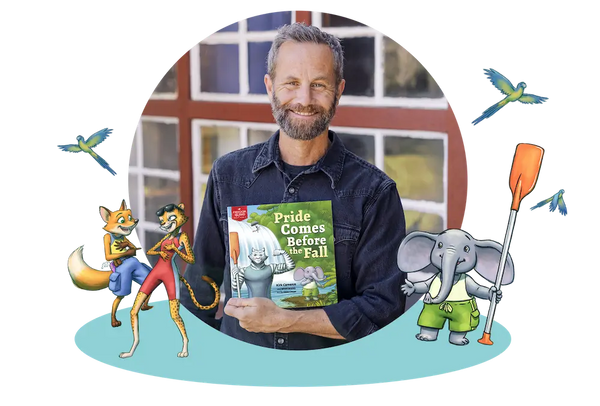 Kirk Cameron holding his children's book, Pride Comes Before the Fall