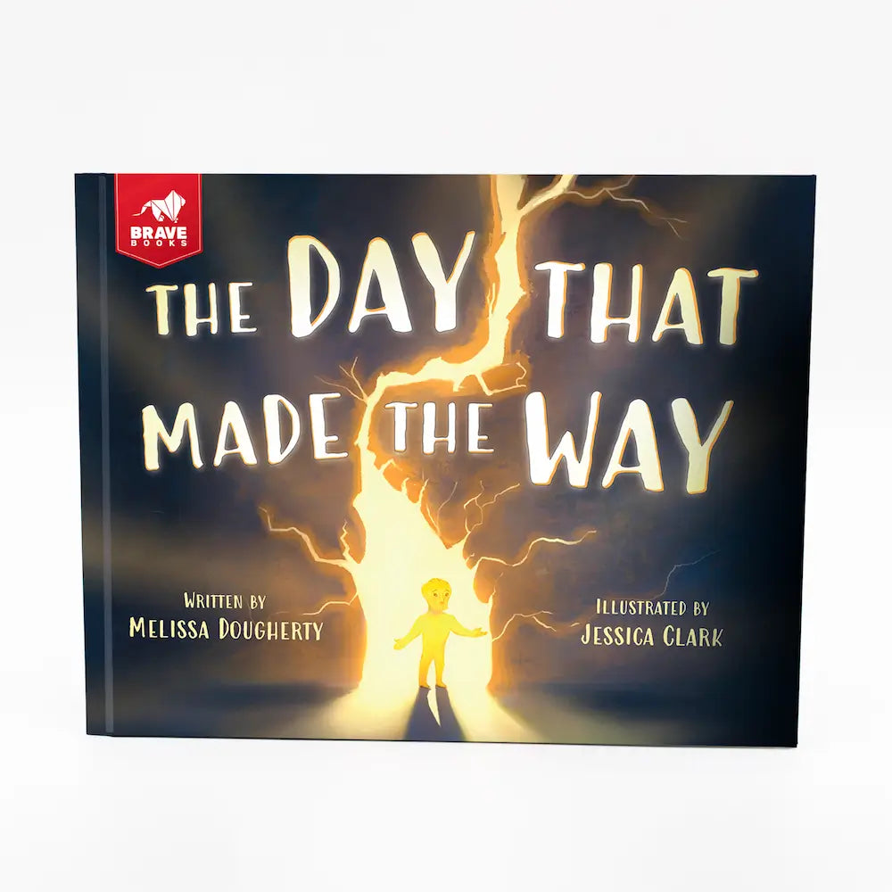Book cover of 'The Day That Made the Way' with a child standing in a beam of light.