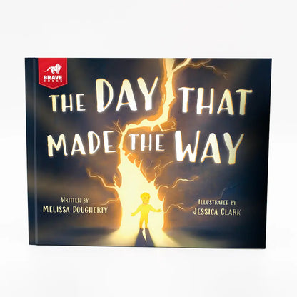 Book cover of 'The Day That Made the Way' with a child standing in a beam of light.