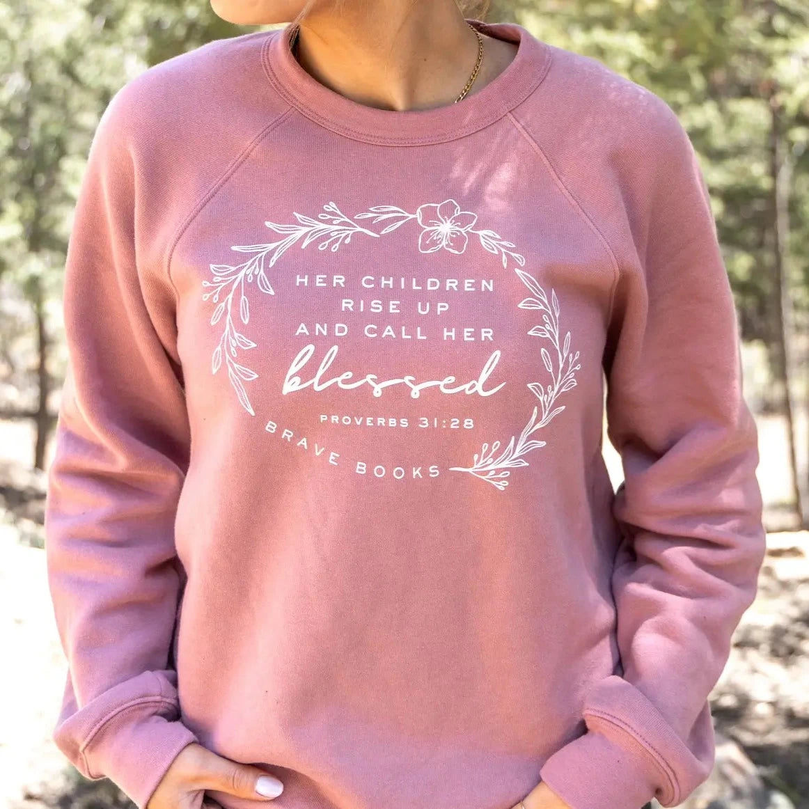 woman wearing BRAVE Books Proverbs mom crew neck