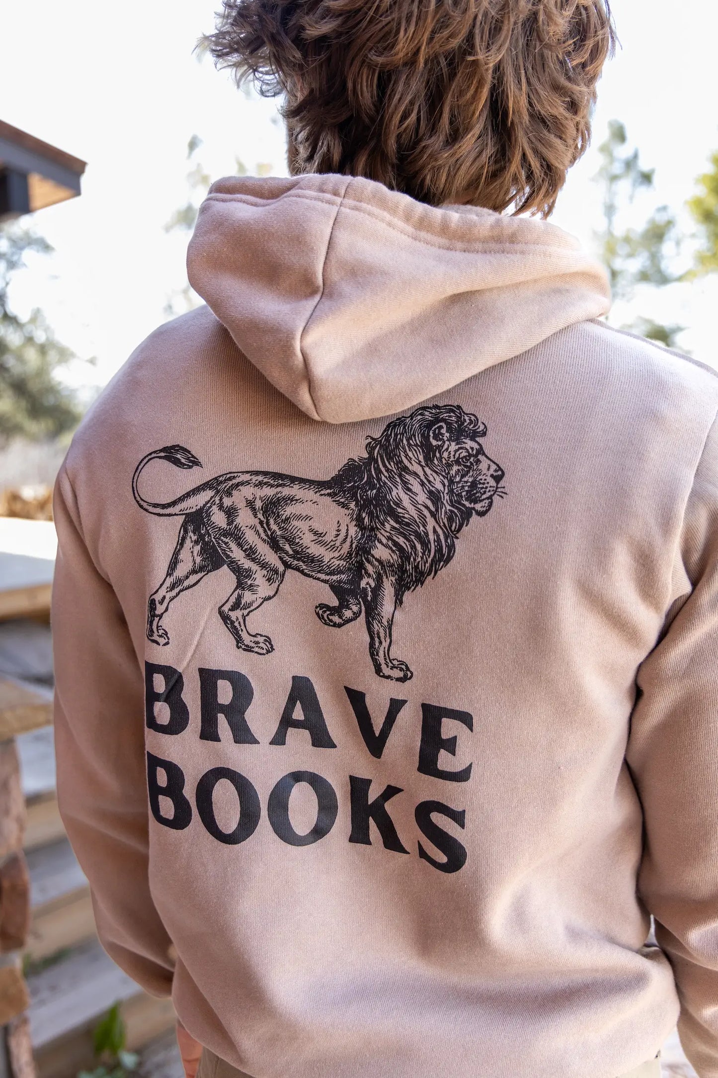 Man wearing BRAVE Books pro-god, pro-America hoodie