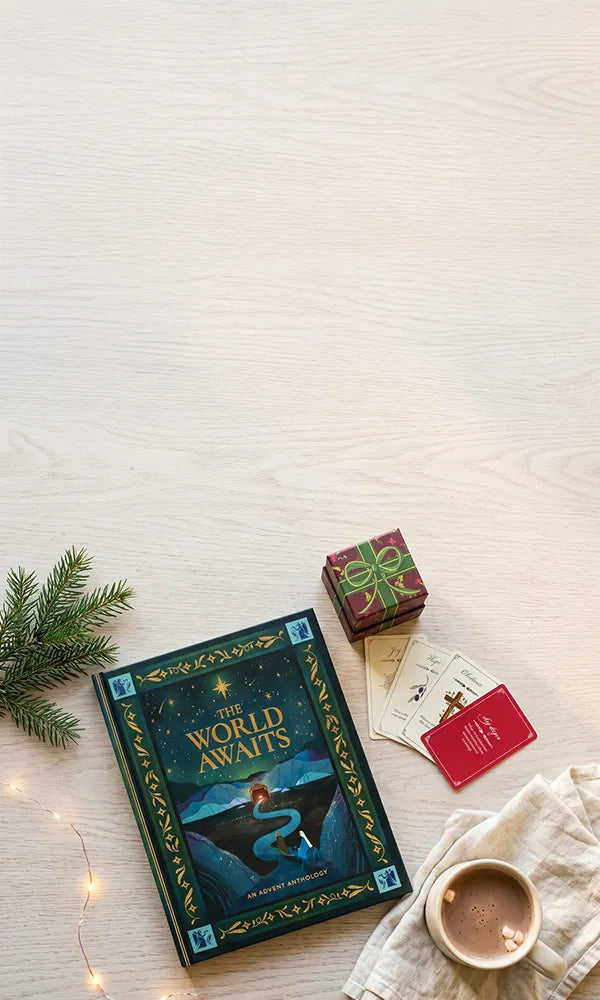 The World Awaits book and conversation cards on a wooden table